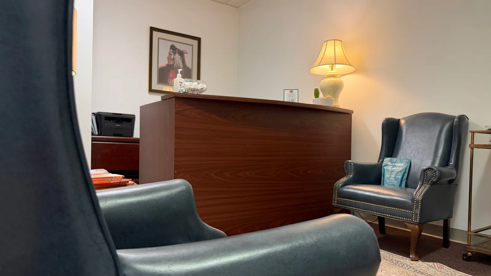 The waiting room at the Maitland office, with leather chairs and the reception desk